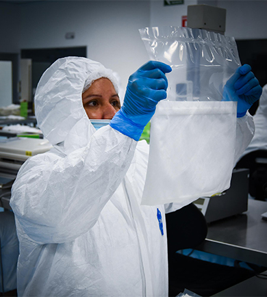 Cleanroom operator inspecting medical device packaging